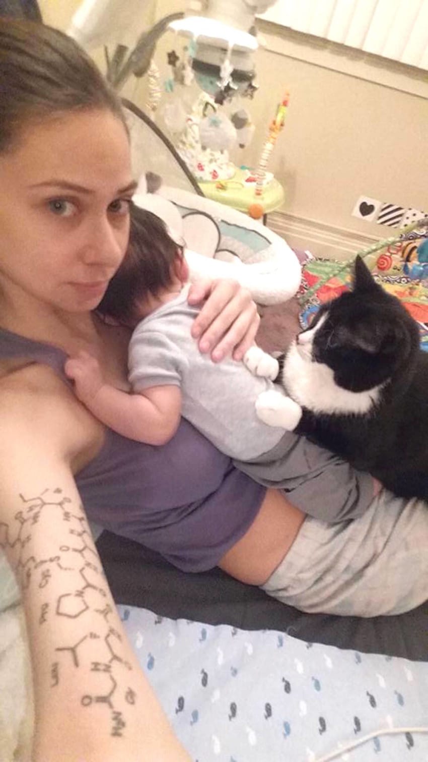 Cat is baby's guardian angel